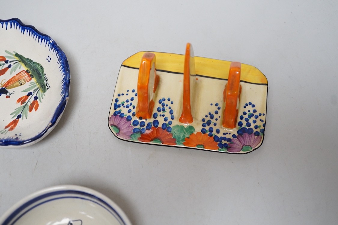 A Clarice Cliff Bizarre Gayday pattern toast rack and a Quimper dish and bowl, toast rack 13cms long x 9cms wide